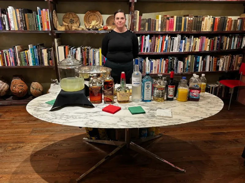 Bartender preparing drinks at an upscale event bar.